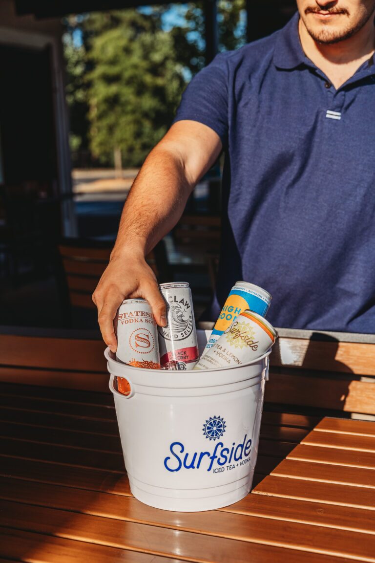 a guy reaching for a can in the Seltzer Bucket